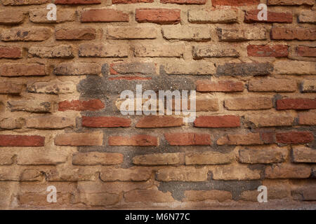 Close up of old brick wall with reflection of the son at dawn for background or texture Stock Photo