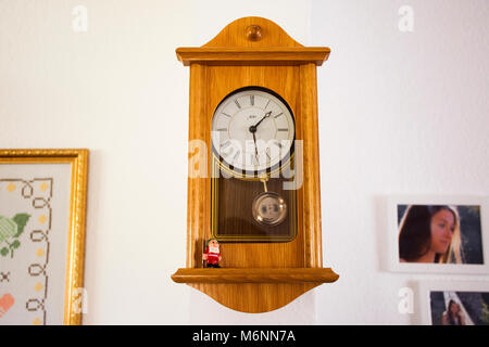 Wooden Classic clock germany style on wall in house on September 9, 2017 in Heidelberg, Germany Stock Photo