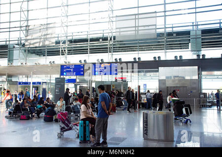 German and foreigner traveler wait flight with passenger arriving and departing at Frankfurt International Airport on September 10, 2017 in Frankfurt, Stock Photo