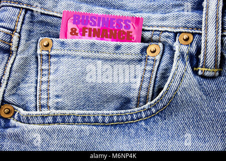 Handwritten text showing Business And Finance. Business concept writing for Company Strategy Written on condom pack in small pocket in the pants jeans Stock Photo