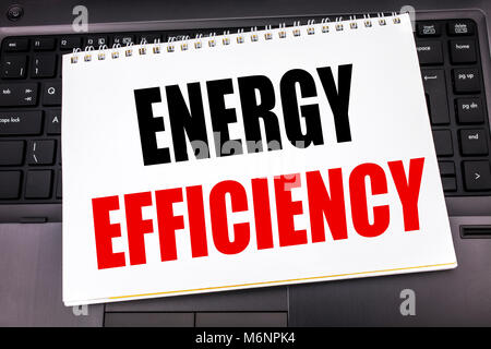 Handwritten text showing Energy Efficiency. Business concept writing for Electricity Ecology written on notepad note paper the black keyboard backgrou Stock Photo