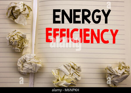 Handwritten text showing Energy Efficiency. Business concept writing for Electricity Ecology Written on notepad paper, white background with space and Stock Photo