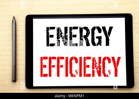 Handwritten text showing Energy Efficiency. Business concept writing for Electricity Ecology Written on tablet computer screen, white background offic Stock Photo