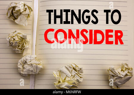 Handwritten text showing Things To Consider. Business concept writing for Business Knowledge Written on notepad paper, white background with space and Stock Photo
