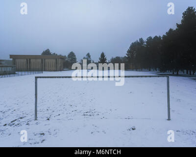 whitewashed soccer field from a heavy snowfall in Lombardy, Italy Stock Photo