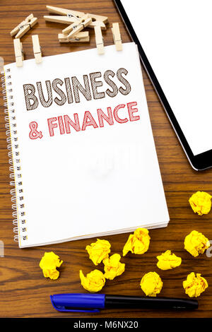 Writing text showing Business And Finance. Business concept for Company Strategy written on note paper folded Meaning Thinking paper on the wooden bac Stock Photo