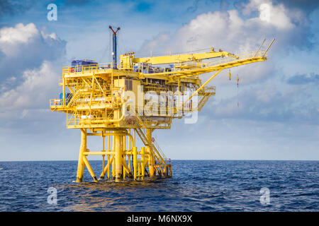 Offshore oil and gas industry, well head remote platform where produced raw gas and crude oil for sent to central processing platform, surface tools o Stock Photo