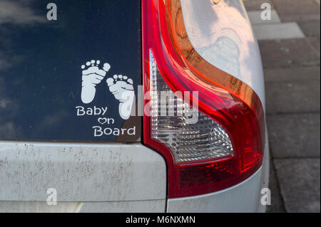 Baby on Board sign in the back of a car Stock Photo