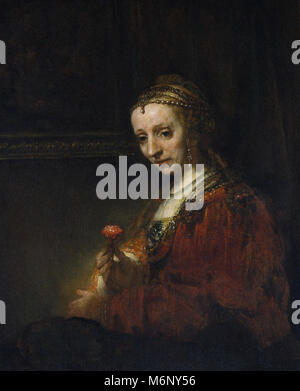 Rembrandt Harmenszoon van Rijn - Woman with a Pink Stock Photo