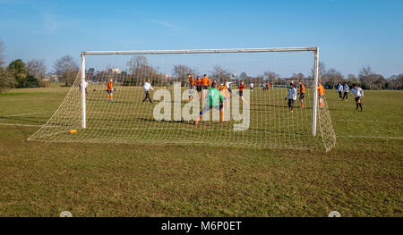 Weekend football match on one of the many pitches on the Downs in Bristol UK Stock Photo