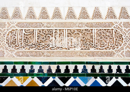 Granada, Andalusia, Spain - April 9th, 2006 : Geometrical patterns and epigraphy in the Court of the Myrtles (Patio de los Arrayanes) of the Comares P Stock Photo