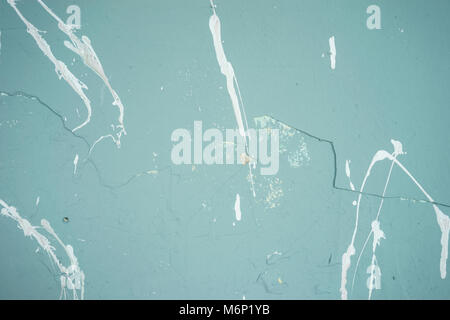 Textured painted turquoise wall with white blots Stock Photo