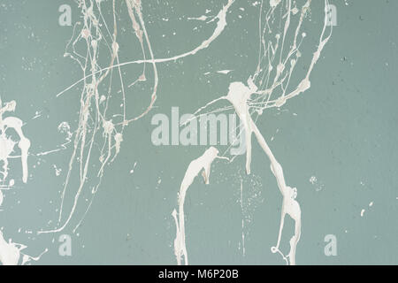Textured painted turquoise or blue wall with white blots Stock Photo