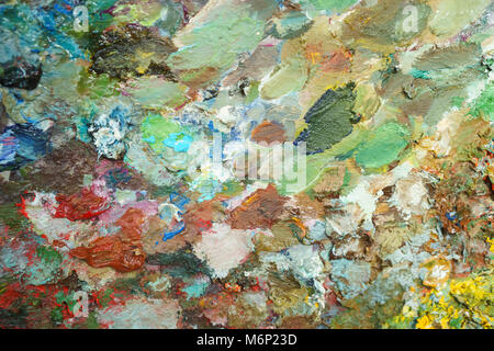 textural multicolored palette of a background of paints made by a brush Stock Photo