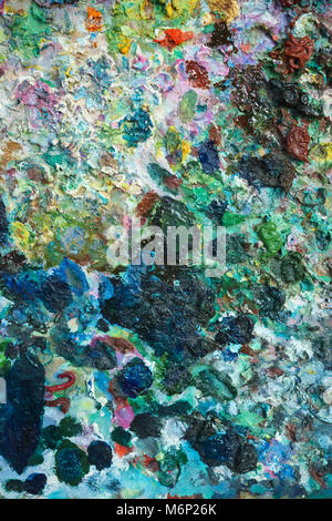 textural multicolored palette of a background of paints made by a brush Stock Photo