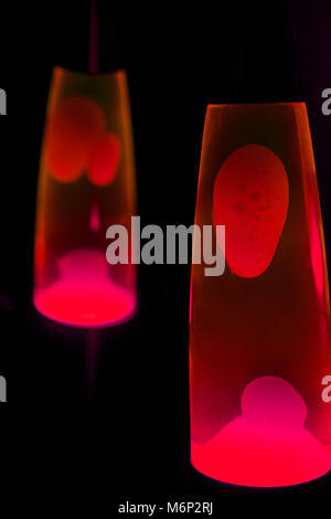 Lava lamp in darkness. Abstract isolated composition Stock Photo