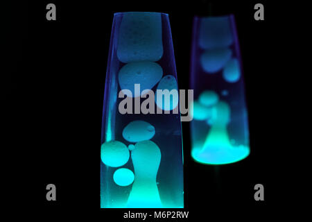 Lava lamp in darkness. Abstract isolated composition Stock Photo