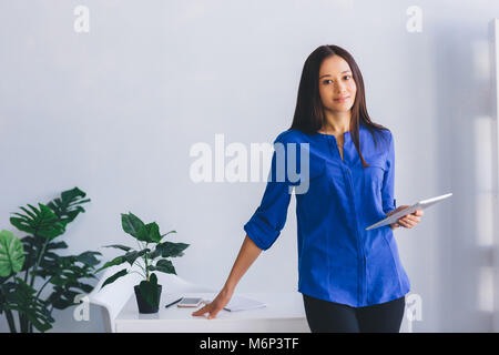 woman office worker, with tablet Stock Photo