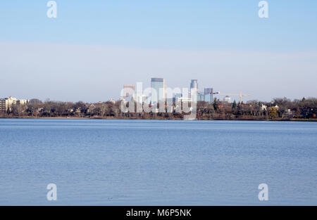 Minneapolis Minnesota skyline standing tall over Lake Calhun. Known as the land of 10,000 lakes. Join St. Paul as Twin Cities split by Mississippi Riv Stock Photo