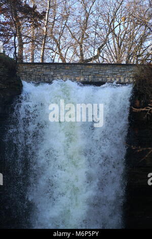 Close up waterfall in Minneapolis Minnesota. Minnehaha falls tight show top of falls. Frozen in winter months Stock Photo