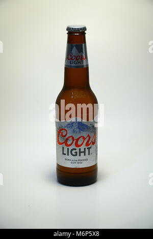 Coors Light beer bottle against white background. Product shot. Silver Bullet alcoholic drink branded cold as rocky mountains in Colorado. Brewed in U Stock Photo