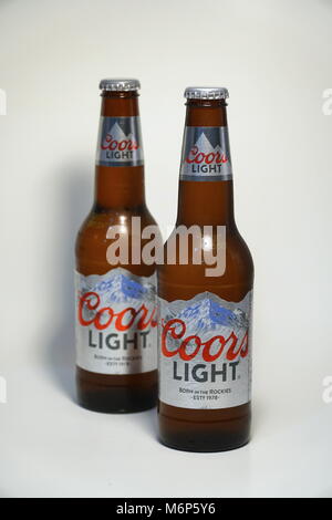 Coors Light beer bottle against white background. Product shot. Silver Bullet alcoholic drink branded cold as rocky mountains in Colorado. Brewed in U Stock Photo