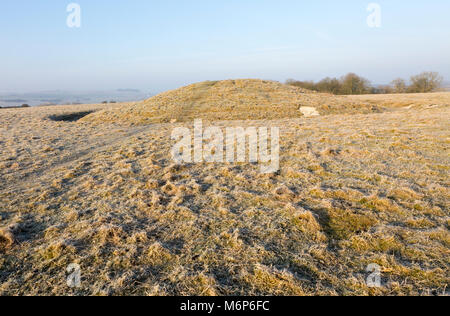 Bronze Age bowl barrow on Windmill Hill, a Neolithic causewayed enclosure, near Avebury, Wiltshire, England, UK Stock Photo