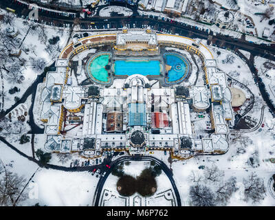 Budapest, Hungary - Aerial view of the famous Szechenyi Thermal bath from above in the snowy City Park at winter time Stock Photo