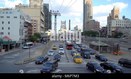 New York City, Circa 2017: Wide view of the Manhattan Queensboro bridge traffic driving on busy urban roads Stock Photo