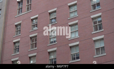Exterior establishing shot of generic brick urban city apartment ...