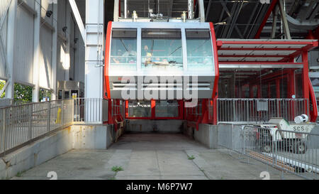 New York City, Circa 2017: Roosevelt Island Tramway cable car straight on view depart station Stock Photo