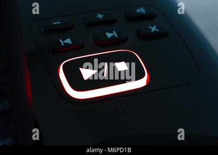The play/stop button on a telephone answer message system. Stock Photo