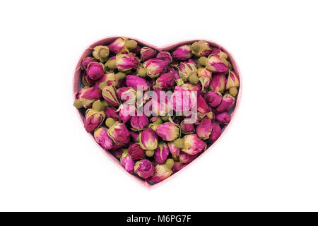 Dried rose buds for tea in the shape of a heart. Chinese tea from Yunnan. Bi Lo Chun. Copy space. Stock Photo