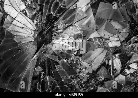 Broken Glass isolated on black background, black and white Stock Photo