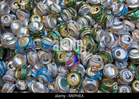 Individually crushed aluminum cans for recycling.  Crushed cans take up one-third the space for more convenient storage and transport. Stock Photo