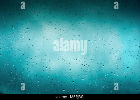 Beautiful cover of gradient background. Rain drops on glass with dark clouds. Greeting for design Stock Photo