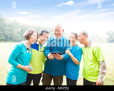 Group of seniors watching the smart phone Stock Photo