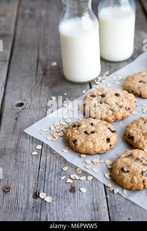 homemade oatmeal cookies with chocolate on an old wooden background. Stock Photo