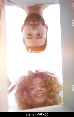 View from the bottom of the newlyweds looking inside the box. Stock Photo