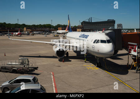 02.06.2017, Berlin, Germany, Europe - A Lufthansa passenger plane is parked at a gate at Berlin's Airport Tegel. Stock Photo