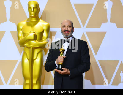 Costume designer Mark Bridges, winner of the Best Costume Design award for 'Phantom Thread,' poses in the press room at the 90th Annual Academy Awards at Hollywood & Highland Center on March 4, 2018 in Hollywood, California Stock Photo