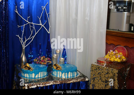 decoration, celebration, entertainment concept. on the table covered with beautiful thin fabric there are burning candles Stock Photo