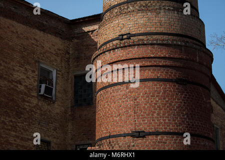 Old industrial building.Old factory chimney.Industrial architecture. Stock Photo