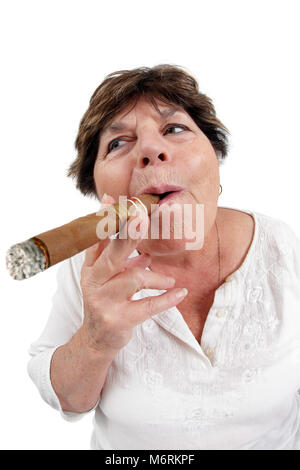 Photo of a woman in her sixties happily smoking a large cuban cigar. Taken with a fisheye lens. Stock Photo