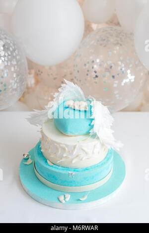 Blue birthday cake for baby. First kid birthday decorations with cake and balloons. Stock Photo