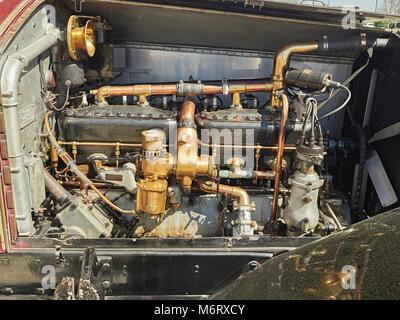 Engine compartment or motor bay of an antique 1924 Rolls Royce Silver Ghost showing the six cylinder motor of the classic vintage British motorcar. Stock Photo