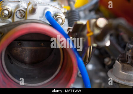 Close up old throttle body intake car four cylinder modified engine Stock Photo