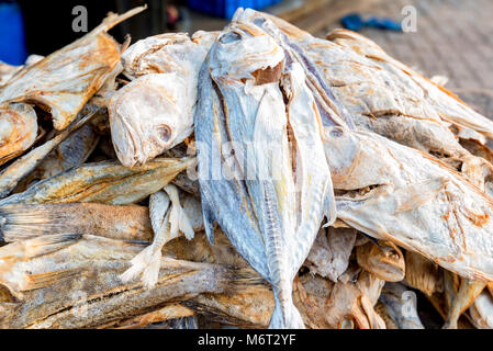 Close up sun-dried fish on wooden table Stock Photo