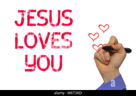Hand with marker writing the word Jesus Loves You Stock Photo