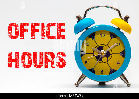 Office hours on a white background. Retro alarm clock. Stock Photo